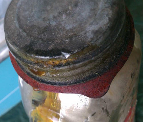 leaking lid on vintage preserves bottle