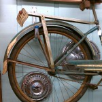 hubcaps behind bike wheel rusty vintage