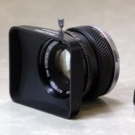 Olympus OM-System 50mm prime lens with hood
