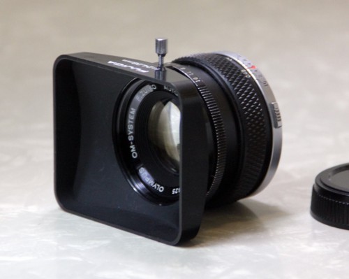 Olympus OM-System 50mm prime lens with hood