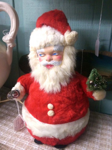 kitschy rubber-faced masked stuffed santa bottle brush tree light