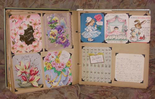 vintage greeting cards in old scrapbook